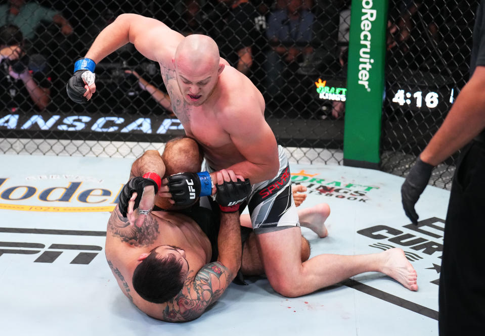 Serghei Spivac of Moldova punches Augusto Sakai of Brazil in a heavyweight fight during the UFC Fight Night event at UFC APEX on August 06, 2022 in Las Vegas, Nevada. (Photo by Chris Unger/Zuffa LLC)