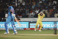 Australia's captain Aaron Finch, right, takes the catch to dismiss India's Virat Kohli, left, during the third T20 cricket match between India and Australia, in Hyderabad, India, Sunday, Sept. 25, 2022. (AP Photo/Mahesh Kumar A)