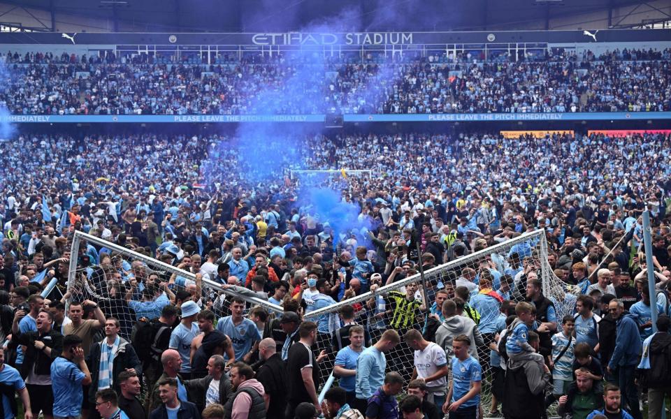 Pitch invasion, goal goes down - OLI SCARFF/AFP via Getty Images