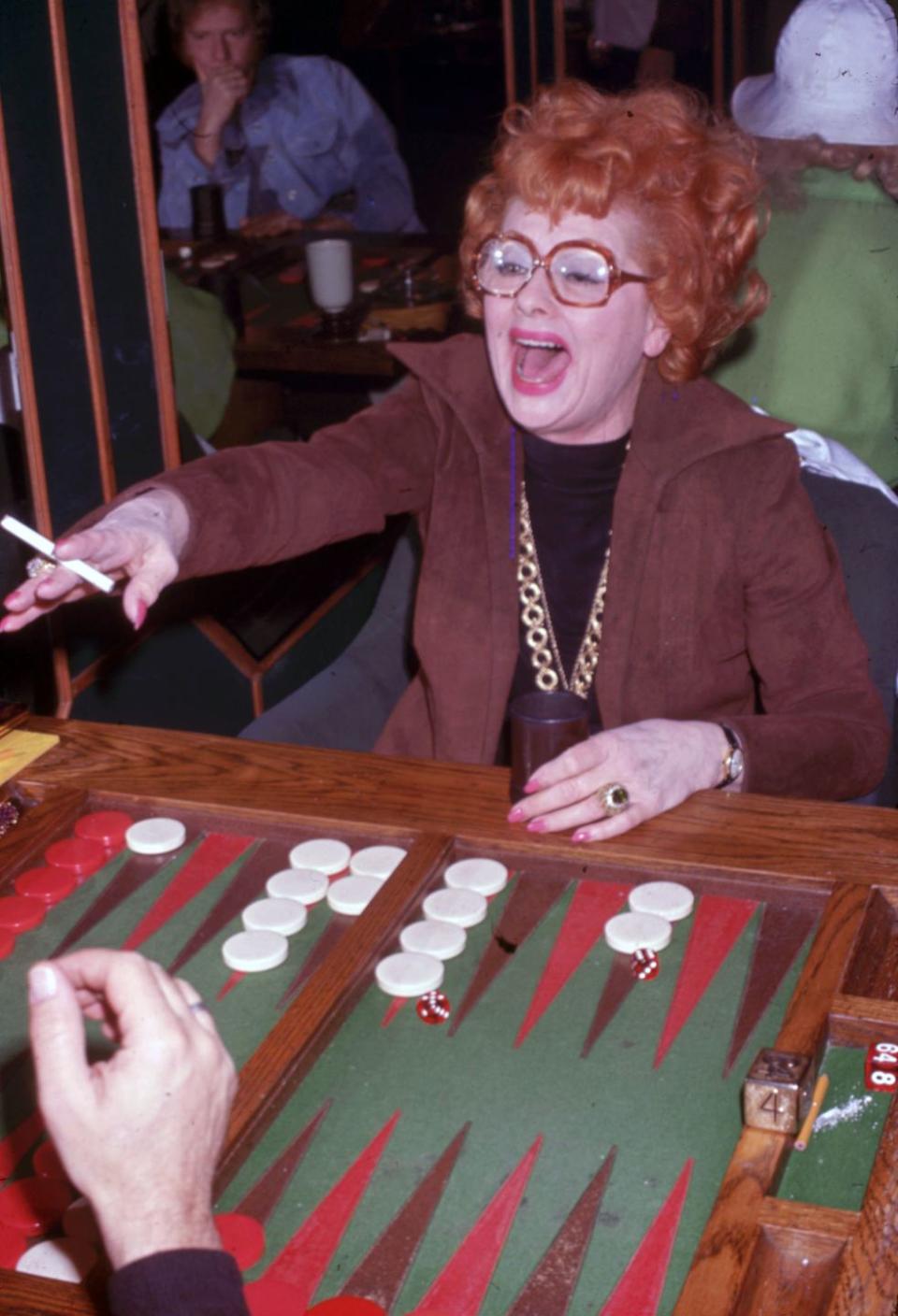 1978: Playing a rousing game of backgammon.