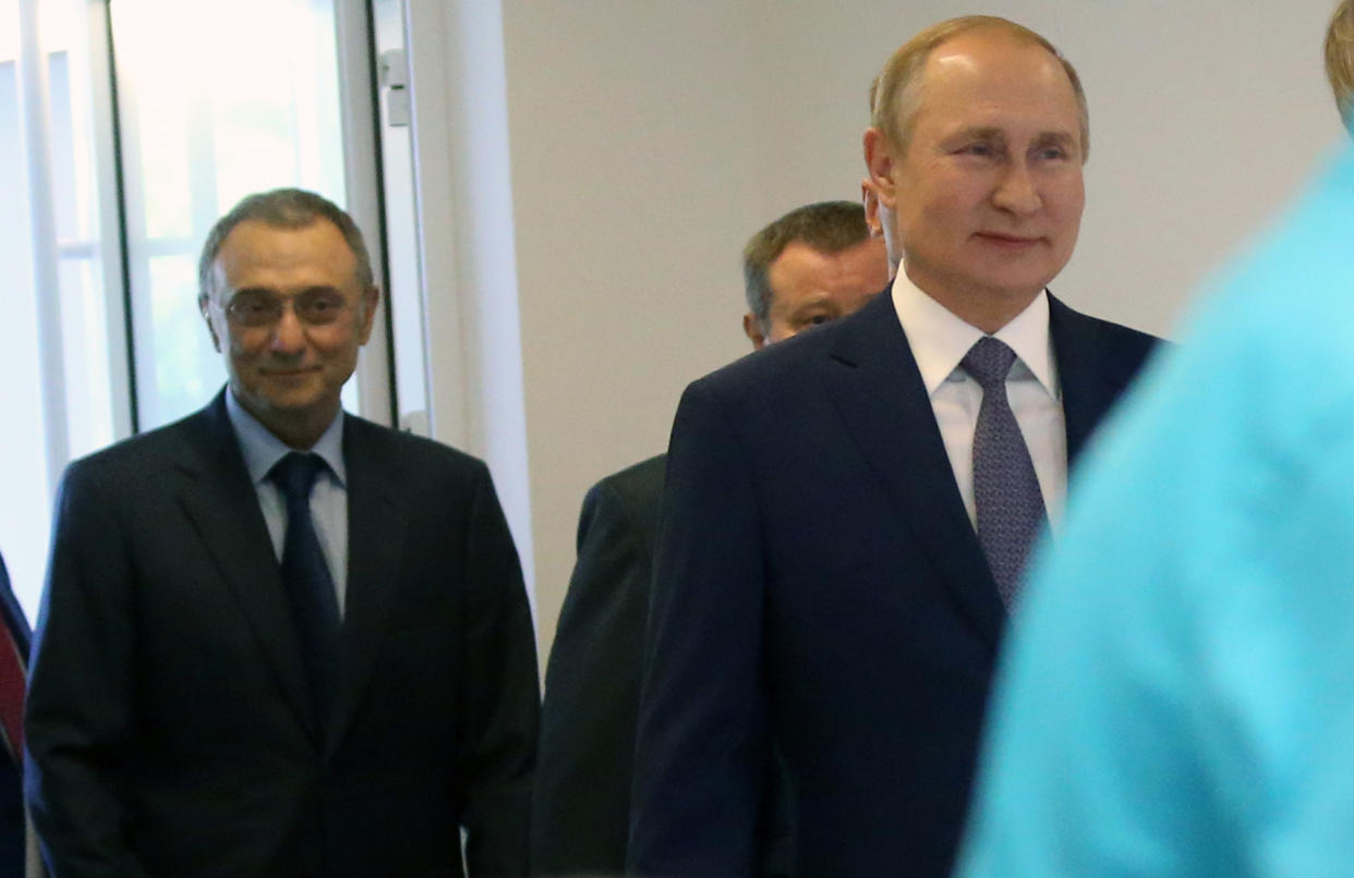 Image: Vladimir Putin and Suleiman Kerimov (Mikhail Svetlov / Getty Images file)