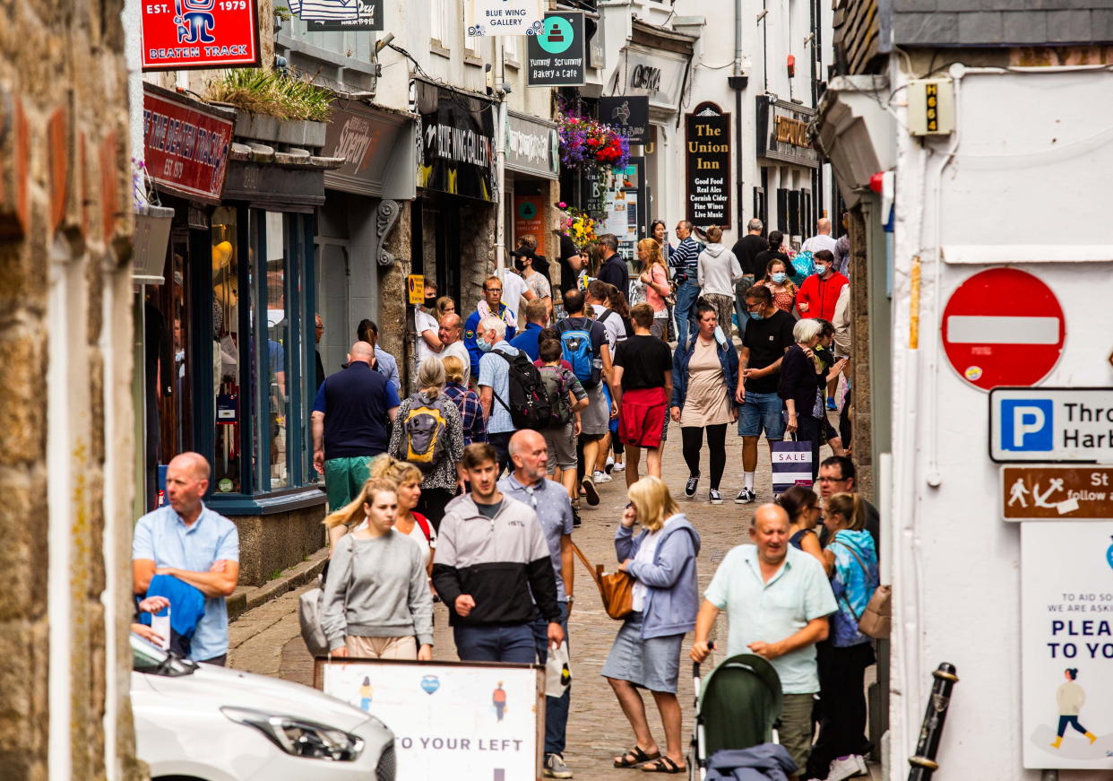 File photo â€“ tourists in St Ives, Cornwall. Photo released April 26 2024. A tourism boss has backed the idea of a tax for holidaymakers coming to Cornwall - but says Devon would need one as well. Malcolm Bell, Chief Executive of Visit Cornwall, admits the idea of implementing a tourist tax upon visitors to the area is a concept he can 'certainly envision' in the future. Malcolm said he believed it 'could work' - but argued Cornwall shouldn't stand along in introducing the charge - amid fears they could lose out to their 'rivals' in Devon. And he said the decision shouldn't be 'rushed' to ensure the proceeds are properly invested - and the tourism industry itself doesn't suffer.  