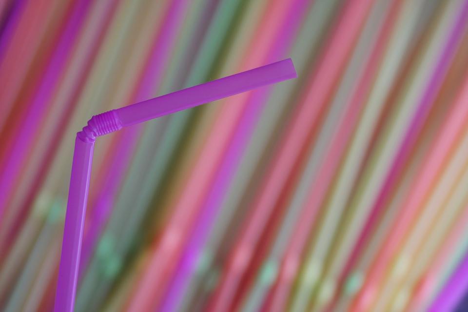 A bendy pink straw is shown in a story about single-use plastic bans in Canada