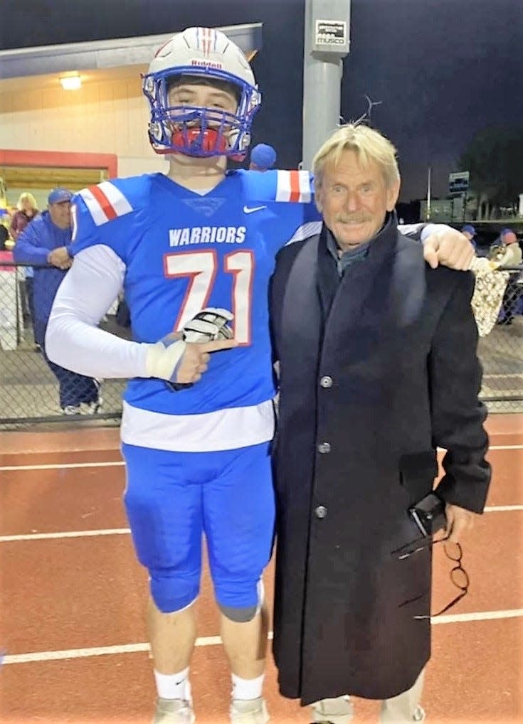 Winnacunnet High School senior football captain Jack Hogan with his uncle Eddie Begley after Winnacunnet's Senior Night game against Londonderry on October 21.