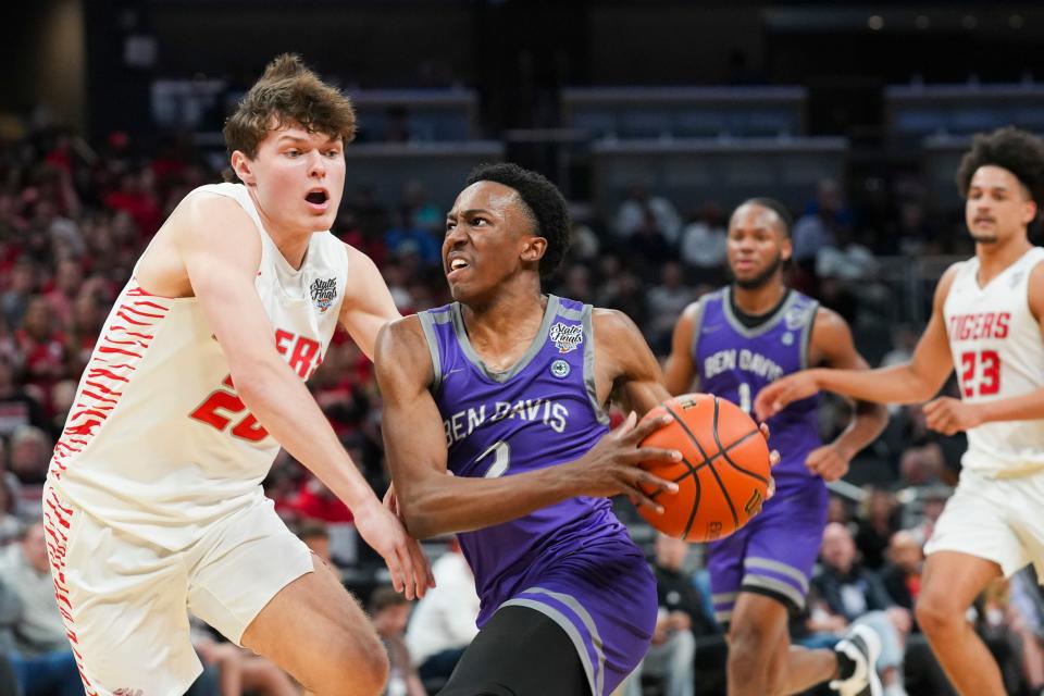 Ben Davis Giants guard Mark Zackery (2) drives the lane against the Fishers Tigers on Saturday, March 30, 2024, during the IHSAA boys basketball Class 4A state championship game at Gainbridge Fieldhouse in Indianapolis. The Fishers Tigers defeated the Ben Davis Giants 65-56.