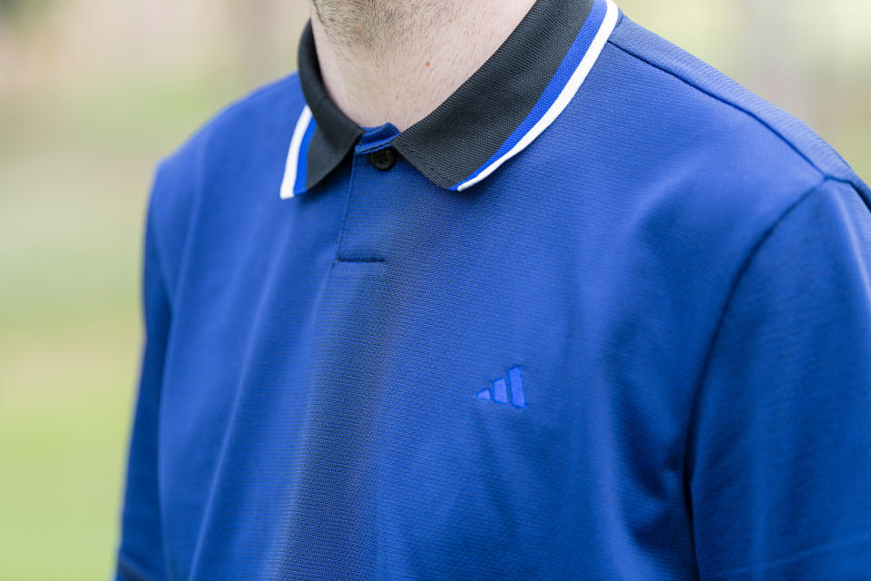 A detail of the collar on the adidas ultimate 365 tour primeknit polo