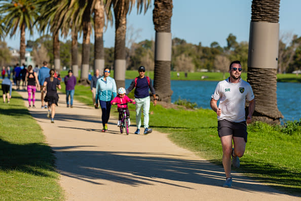 On the first weekend of partial freedom, joggers made the most of Melbourne's sunny Autumn weather at Albert Park Lake as restrictions are being eased in Victoria.