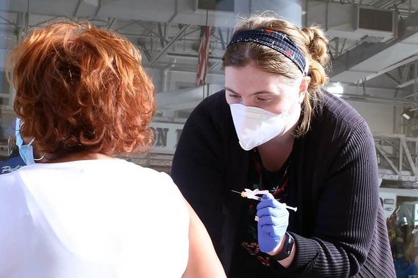 Faith Terrell, RN-BSN, Class of '22, volunteers during a Saturday, Dec. 4, 2021, COVID-19 community vaccination event at the Trenton Fire Department on Perry Street.
