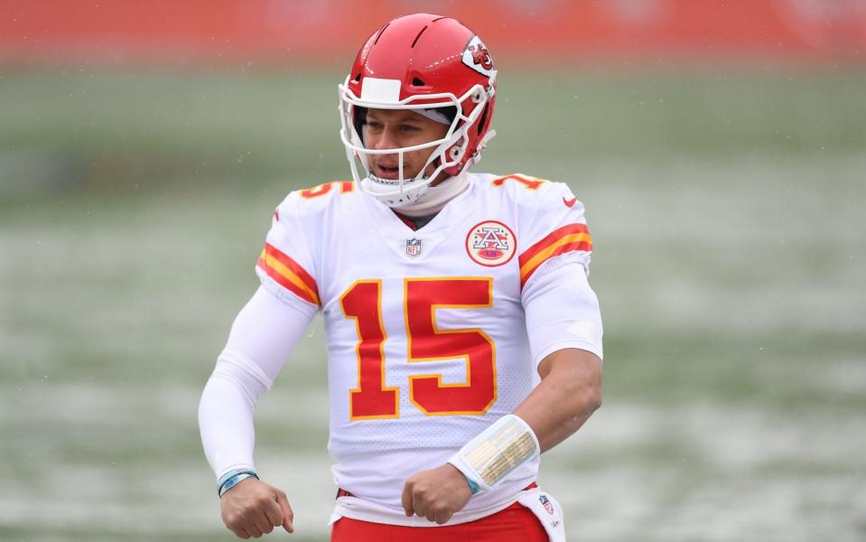 Kansas City Chiefs quarterback Patrick Mahomes (15) celebrates a score in the first quarter against the Denver Broncos at Empower Field at Mile High. - Ron Chenoy-USA TODAY Sports