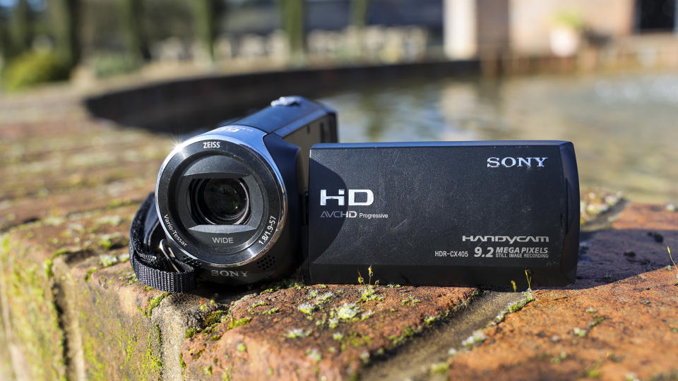 A front-on view of the Sony HDR-CX405 camcorder on a wall