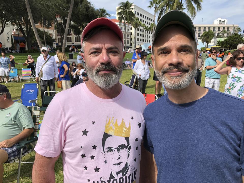 Billy Wolfe, left, and Mike Makoul attend a Democratic campaign concert by Jimmy Buffett on Saturday, Nov. 3, 2018, in West Palm Beach, Fla. They said they wanted to support Tallahassee Mayor Andrew Gillum, the party’s nominee for governor, who spoke at the rally. They said change is needed on many fronts. (AP Photo/Terry Spencer)