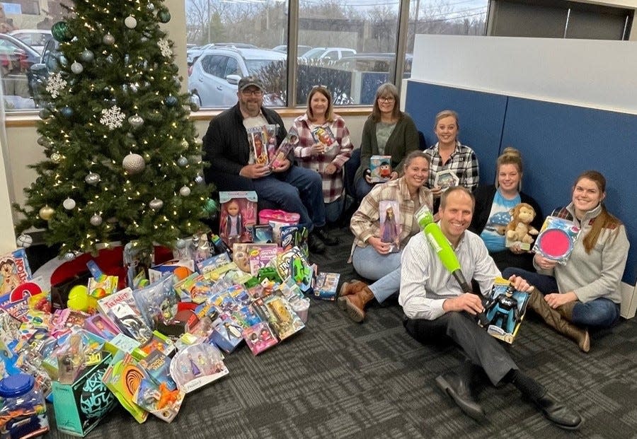 Paul Hemmer Company employees take part in the Toys for Tots drive.