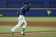 Tampa Bay Rays' Wander Franco reacts as he runs around the bases after his three-run home run off Boston Red Sox starting pitcher Eduardo Rodriguez during the fifth inning of a baseball game Tuesday, June 22, 2021, in St. Petersburg, Fla. (AP Photo/Chris O'Meara)