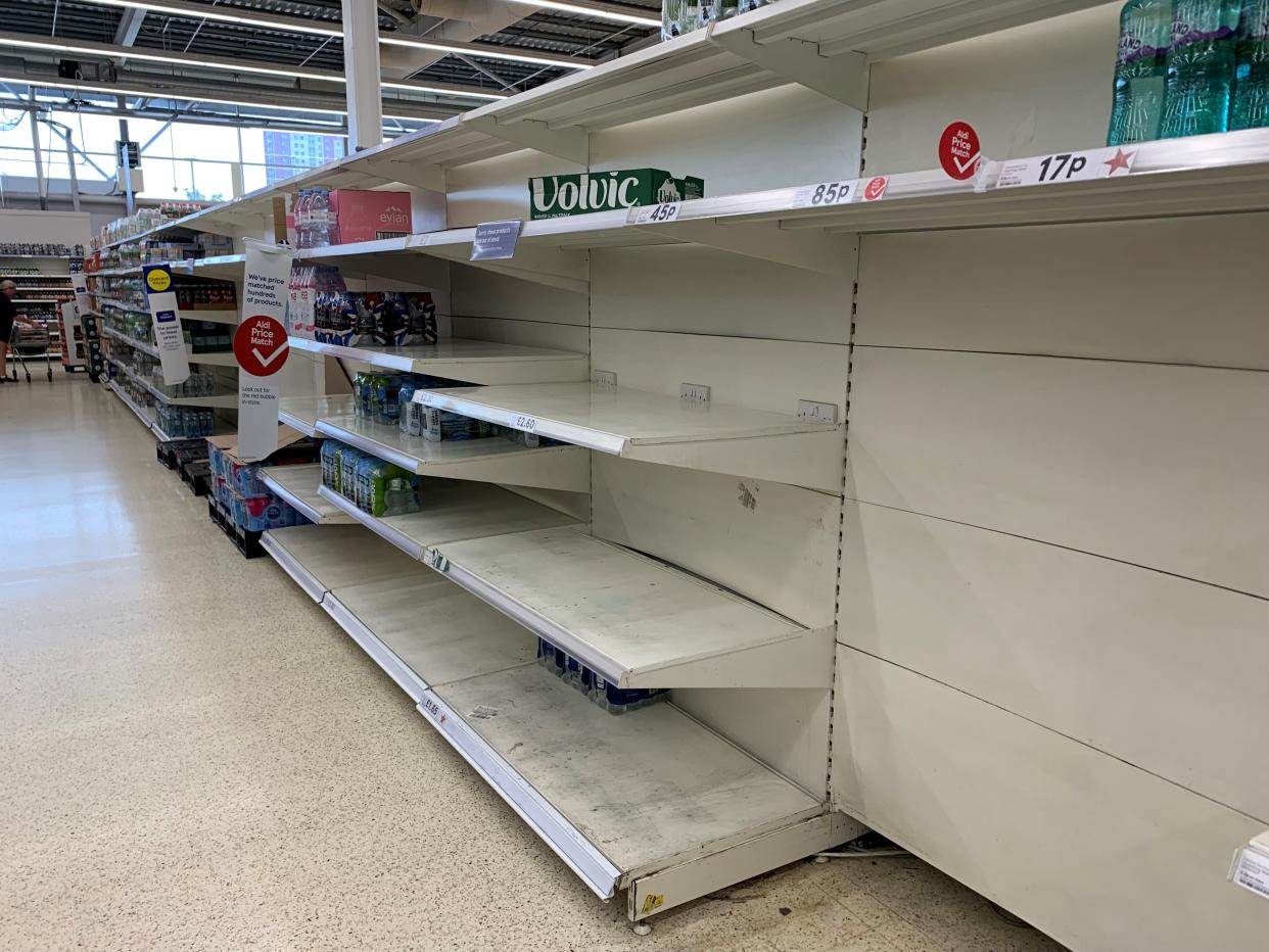 Empty shelves in the water aisle of the Tesco store at St Rollox in Glasgow (Andrew Milligan/PA) (PA Wire)