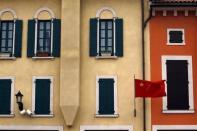 A Chinese national flag flies from buildings resembling those found in an Italian town at the Florentia Village in the district of Wuqing, located on the outskirts of the city of Tianjin June 13, 2012. <br><br><a href="http://news.yahoo.com/photos/china-replicates-austrian-village-slideshow/" data-ylk="slk:Click here;elm:context_link;itc:0;sec:content-canvas;outcm:mb_qualified_link;_E:mb_qualified_link;ct:story;" class="link  yahoo-link">Click here</a> to see a related gallery: China replicates Austrian village