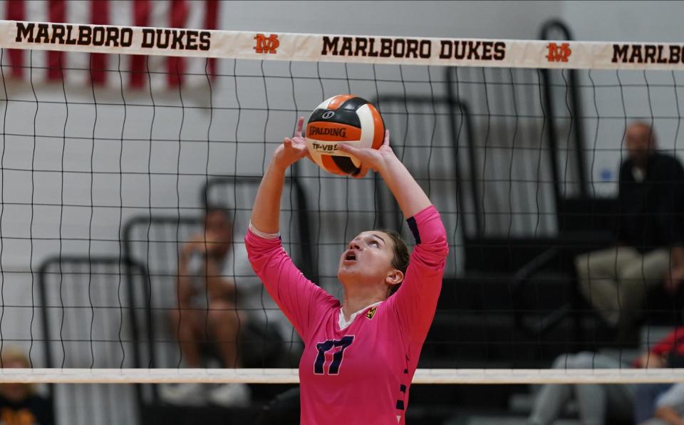 Our Lady of Lourdes setter Vanessa Seymour readies to lob a pass up for a teammate during an Oct. 11, 2022 volleyball game against Marlboro.