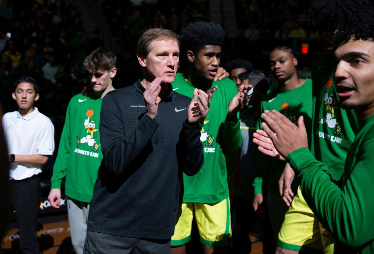 Oregon coach Dana Altman, center, gathers his team before their game against then-No. 3 Houston at Matthew Knight Arena Nov. 20.