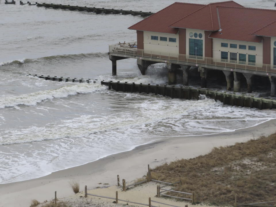 Only a narrow strip of sand sits between the ocean waves and the dunes in front of the Ocean Casino Resort in Atlantic City N.J. on March 13, 2024. The Ocean, Resorts and Hard Rock casinos want the federal government to accelerate a beach replenishment project so that they have usable beaches this summer, but the U.S. Army Corps of Engineers says it could be fall before the work begins. (AP Photo/Wayne Parry)