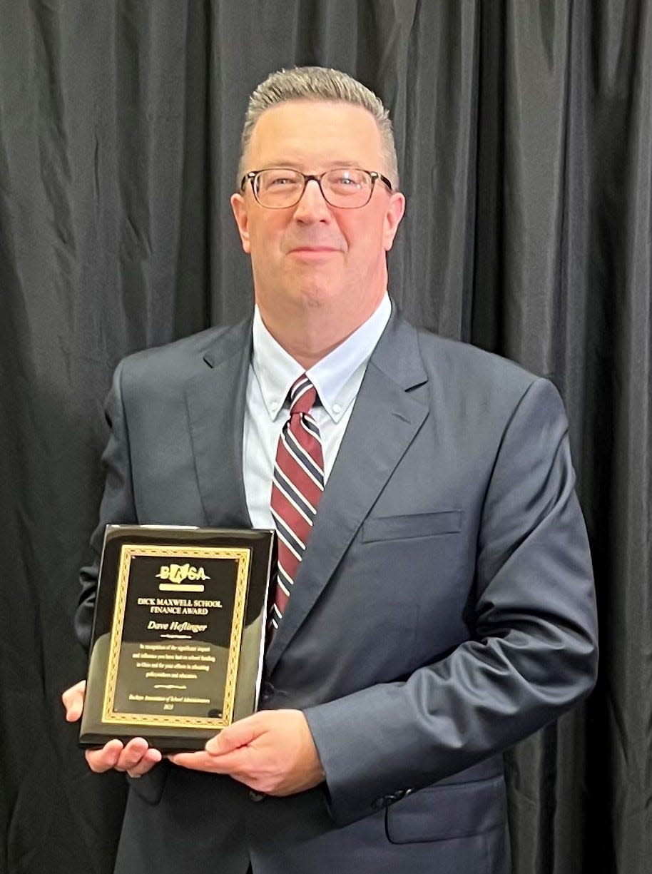 Field schools Superintendent David Heflinger holds the Dick Maxwell Award he received during the Buckeye Association of School Administrators fall conference Oct. 3.