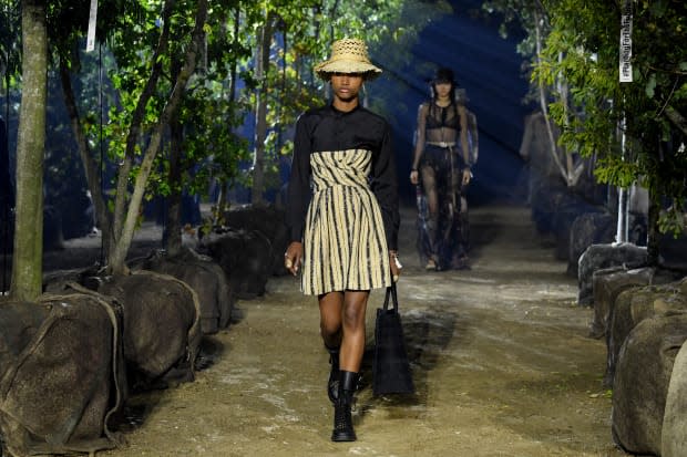 Trees that were to be re-planted later served as the set backdrop for the Christian Dior Spring 2020 runway show. Photo: Pascal Le Segretain/Getty Images