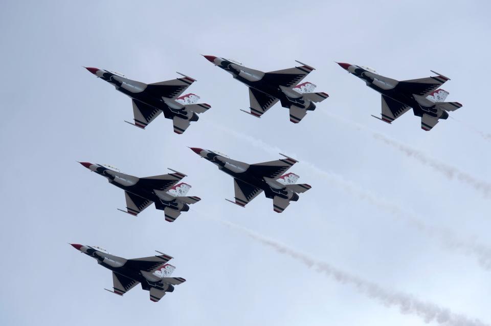 The United States Air Force Air Demonstration Squadron, the Thunderbirds, streak across the skies over Pensacola Naval Air Station Monday April 24, 2017.
