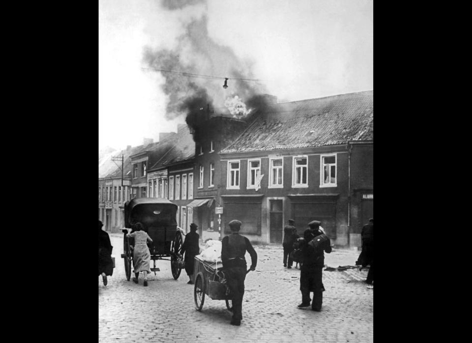 During German air raids on open Belgium towns, this picture shows refugees leaving the city during the bombing of the town May 19, 1940. AFP/Getty Images