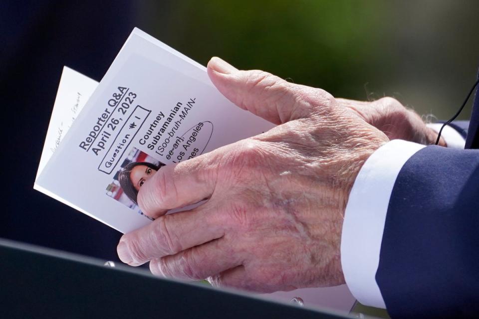 An image of Los Angeles Times correspondent Courtney Subramanian is seen as President Joe Biden looks through notes during a news conference with South Korea's President Yoon Suk Yeol in the Rose Garden of the White House on Wednesday, April 26, 2023 (AP)