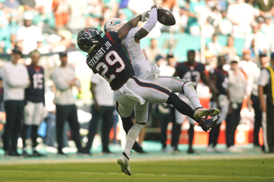 Houston Texans safety M.J. Stewart (29) defends Miami Dolphins wide receiver Jaylen Waddle (17) during the first half of an NFL football game, Sunday, Nov. 27, 2022, in Miami Gardens, Fla. (AP Photo/Michael Laughlin)
