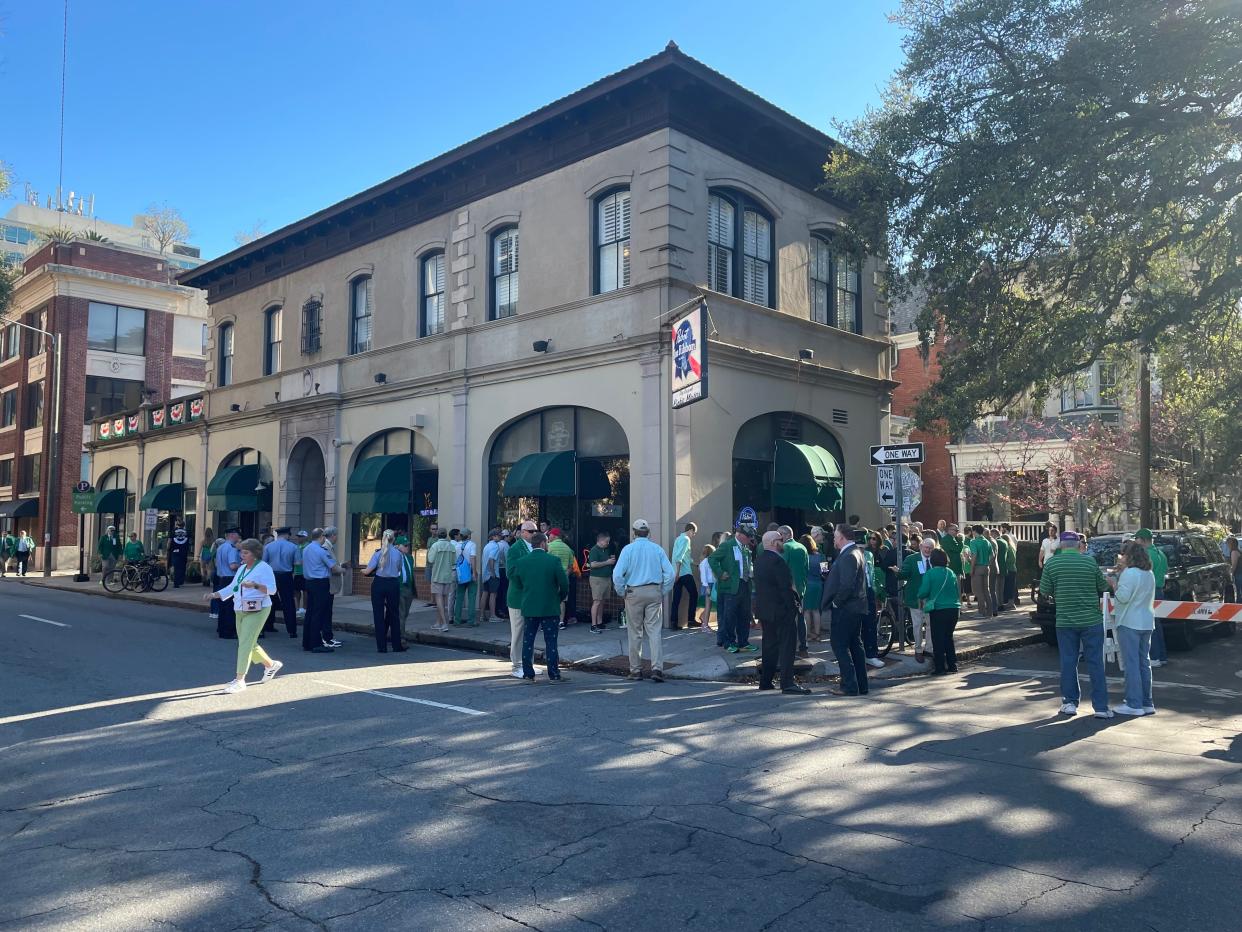 The crowd is flowing into Pinkie Master's as the 2022 Savannah St. Patrick's Day Parade rolls through downtown.