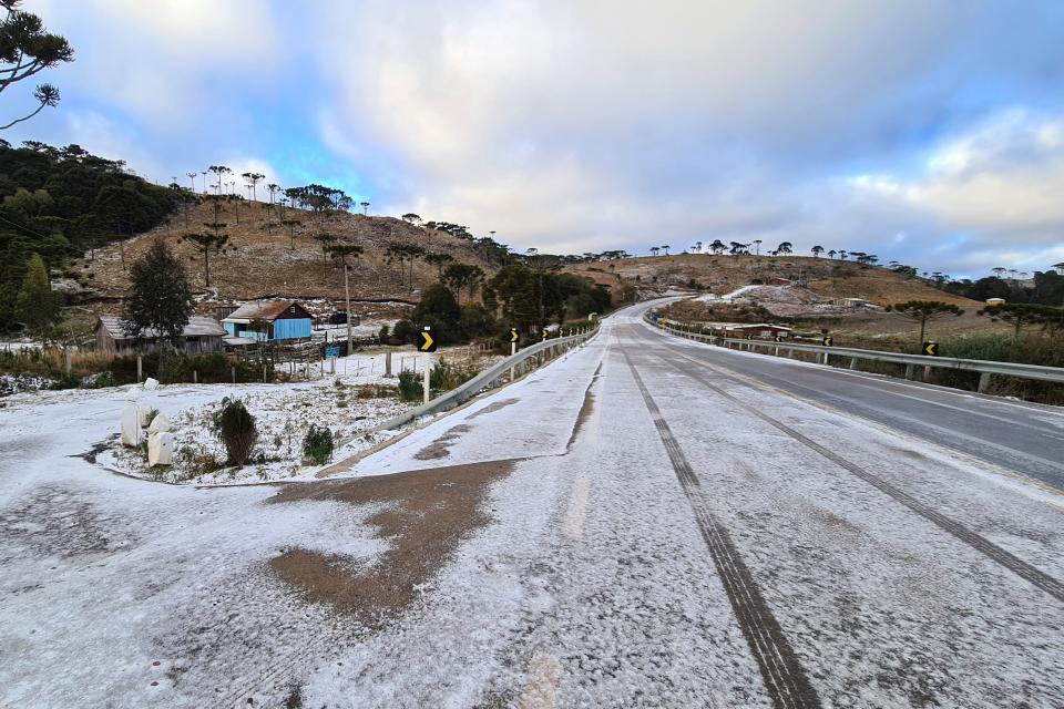 Snow covers the road to Sao Joaquim, Brazil, Thursday, July 29, 2021. A fierce cold snap on Wednesday night prompted snowfall in southern Brazil where such weather is a phenomenon. (AP Photo/Mycchel Legnaghi) ORG XMIT: XEP116