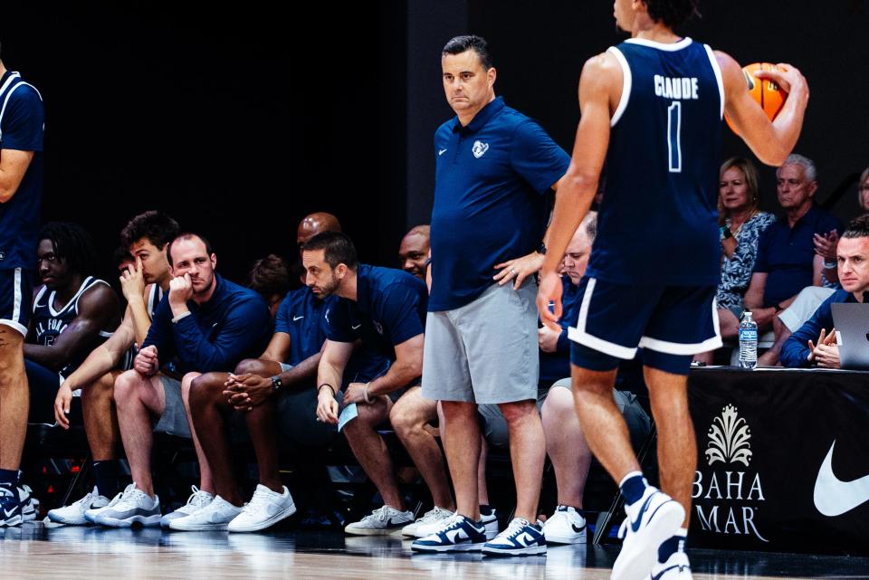 Sean Miller watches as Desmond Claude (1) brings the ball up the court in Xavier's exhibition game against University of Victoria on Aug. 8, 2023 in the Baha Mar Hoops Summer League in Nassau, Bahamas.