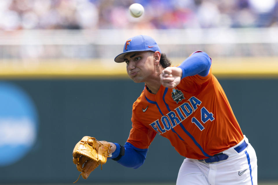 FILE - Florida starting pitcher Jac Caglianone throws during the first inning of a baseball game against TCU at the NCAA College World Series in Omaha, Neb., Wednesday, June 21, 2023. Florida, the No. 3 seed in the Stillwater Regional, opens play against second-seeded Nebraska on Friday. Caglianone will start the regional in his usual spot at first base and will pitch Saturday against either host Oklahoma State or Niagara. (AP Photo/Rebecca S. Gratz, File)