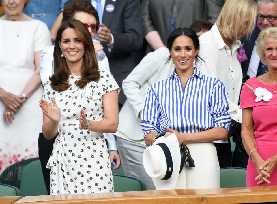 <p>The Duchess of Cambridge and the Duchess of Sussex made their first joint solo appearance at Wimbledon to watch Serena Williams play Germany's Angelique Kerber. <a href="https://www.townandcountrymag.com/style/fashion-trends/a22145209/kate-middleton-polka-dot-dress-wimbledon-2018-photos/" rel="nofollow noopener" target="_blank" data-ylk="slk:Kate wore a polka-dot Jenny Packham dress;elm:context_link;itc:0;sec:content-canvas" class="link ">Kate wore a polka-dot Jenny Packham dress</a>.</p>