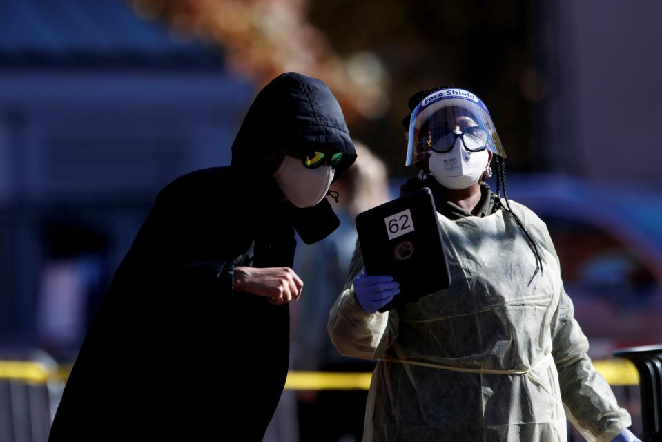 (201114) -- WASHINGTON, Nov. 13, 2020 (Xinhua) -- A healthcare worker helps people check in for a COVID-19 test at a testing site in Washington, D.C., the United States, Nov. 13, 2020. The United States reported an all-time high of nearly 200,000 new COVID-19 cases Thursday, setting a new record for the fifth time in a week, data updated Friday by the U.S. Centers for Disease Control and Prevention (CDC) show. (Photo by Ting Shen/Xinhua) (Xinhua/Ting Shen via Getty Images)