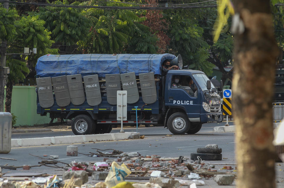 Policemen leave after vandalizing makeshift barricades made by anti-coup protesters in Yangon, Myanmar Thursday, March 11, 2021. Amnesty International accused Myanmar's military government on Thursday of increasingly using battlefield weapons against peaceful protesters and conducting systematic, deliberate killings. (AP Photo)