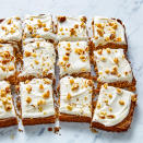 <p>Classic carrot cake flavors abound in these easy bars. They're rich like brownies, but their cake-like texture helps keep them light. A yogurt and cream cheese-based frosting topped with nutty walnuts completes this crowd-pleasing dessert. If you're avoiding gluten, look for gluten-free oat flour or make your own by processing gluten-free oats into powder in your high-speed blender. <a href="https://www.eatingwell.com/recipe/7952413/carrot-cake-bars/" rel="nofollow noopener" target="_blank" data-ylk="slk:View Recipe" class="link ">View Recipe</a></p>
