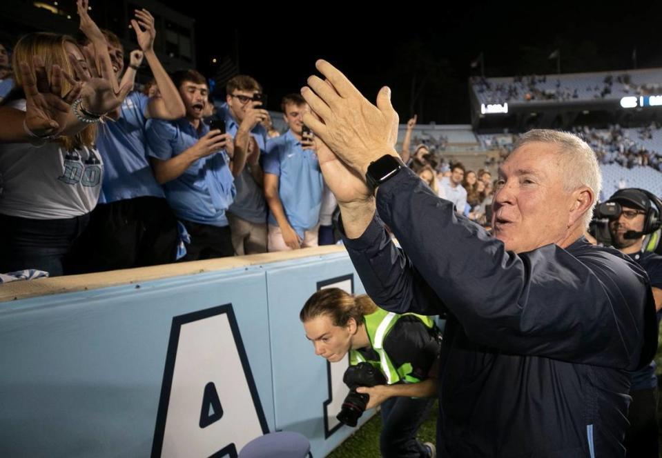 North Carolina coach Mack Brown celebrates with the student section following the Tar Heels’ 20-17 victory over Duke on Saturday, October 26, 2019 at Kenan Stadium in Chapel Hill, N.C.