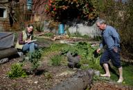 Burrell, left and husband Seifert, whose home-based business has been shuttered, at their home in Seattle