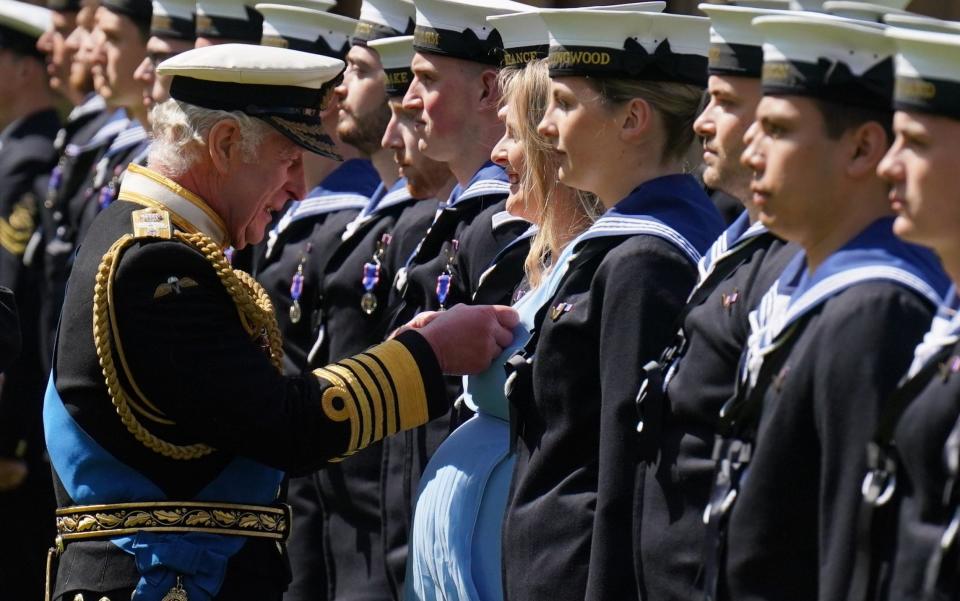 King Charles presents navy medical assistant Paisley Chambers-Smith with her medal - Jonathan Brady/PA