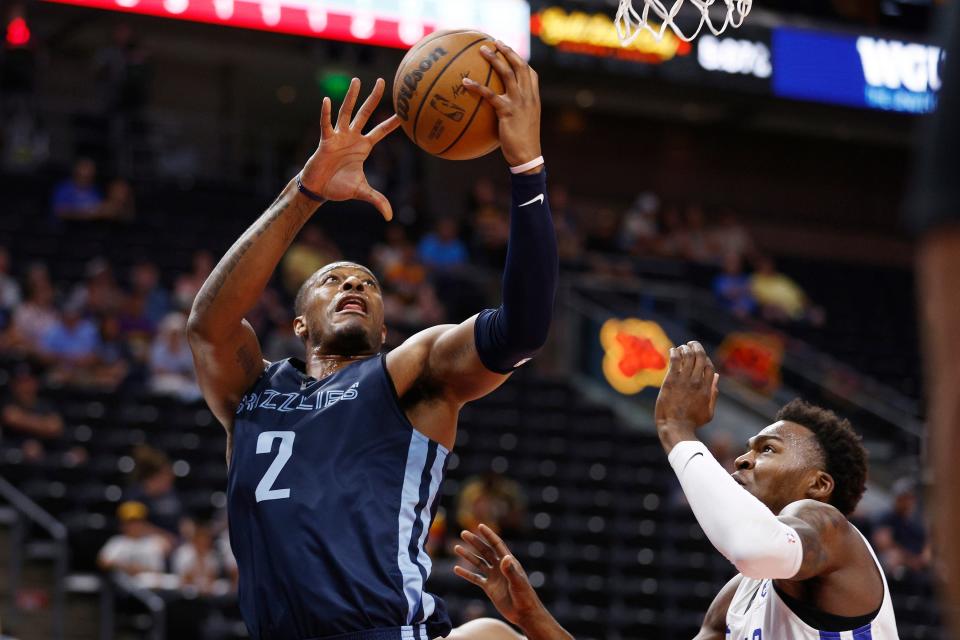 Memphis Grizzlies center Xavier Tillman (2) shoots against Philadelphia 76ers forward Paul Reed Jr. during the first quarter of an NBA summer league basketball game Tuesday, July 5, 2022, in Salt Lake City.