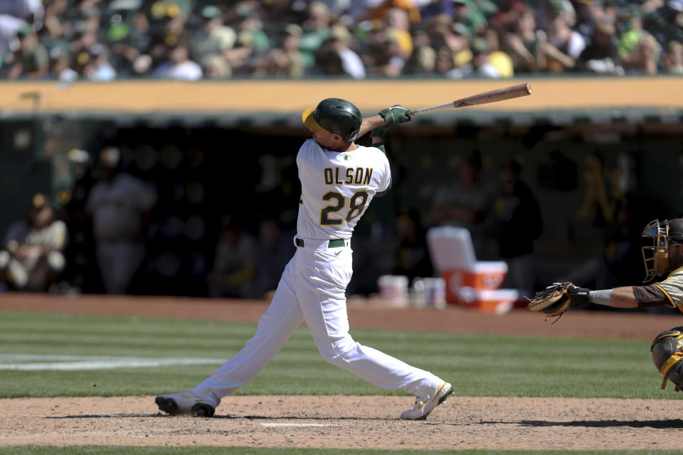 Oakland Athletics' Matt Olson hits a game winning double against the San Diego Padres during the tenth inning of a baseball game in Oakland, Calif., Wednesday, Aug. 4, 2021. (AP Photo/Jed Jacobsohn)