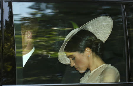 Britain's Prince Harry and Meghan, the Duchess of Sussex, arrive at a garden party at Buckingham Palace, London, May 22, 2018. REUTERS/Simon Dawson