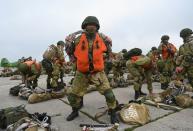 Russian paratroopers take part in drills at a military aerodrome in Taganrog