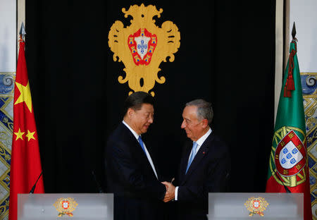 China's President Xi Jinping and Portuguese President Marcelo Rebelo de Sousa shake hands during a news conference in Lisbon, Portugal, December 4, 2018. REUTERS/Pedro Nunes