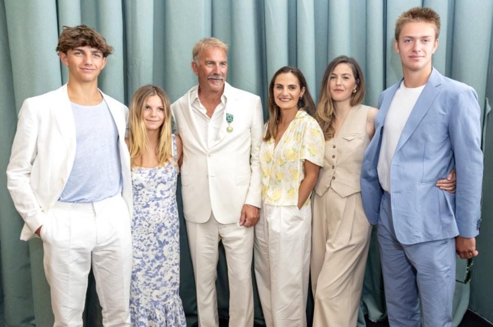 Kevin Costner receives the Order of Arts and Letters from the Minister of Culture with (L-R) Hayes Logan Costner, Grace Avery Costner, Kevin Costner, Annie Costner, Lily Costner, and Cayden Wyatt Costner at the 77th annual Cannes Film Festival at Palais des Festivals on May 19, 2024.<p>Getty Images</p>