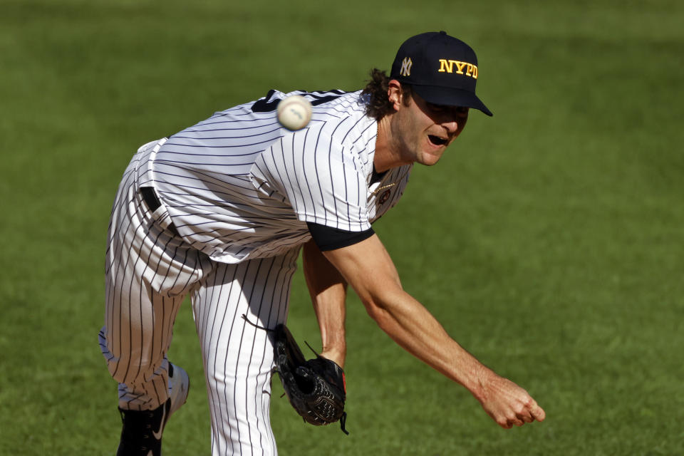 New York Yankees pitcher Gerrit Cole delivers a pitch during the first inning of the first baseball game of a doubleheader against the Baltimore Orioles, Friday, Sept. 11, 2020, in New York. (AP Photo/Adam Hunger)