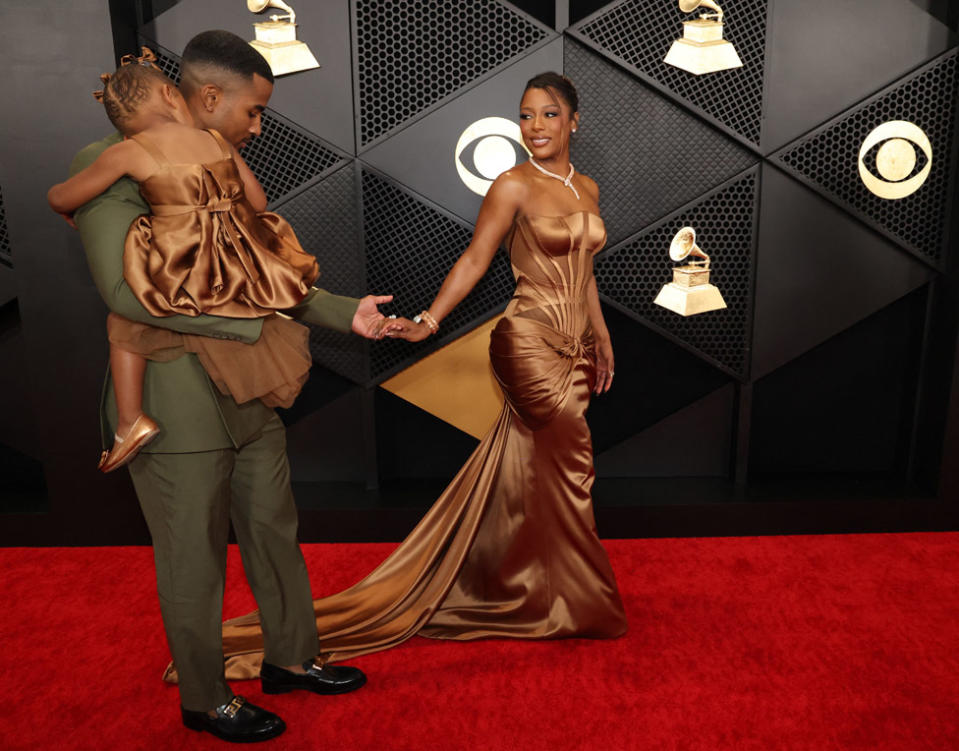 Victoria Monet and her partner and daughter at the Grammys