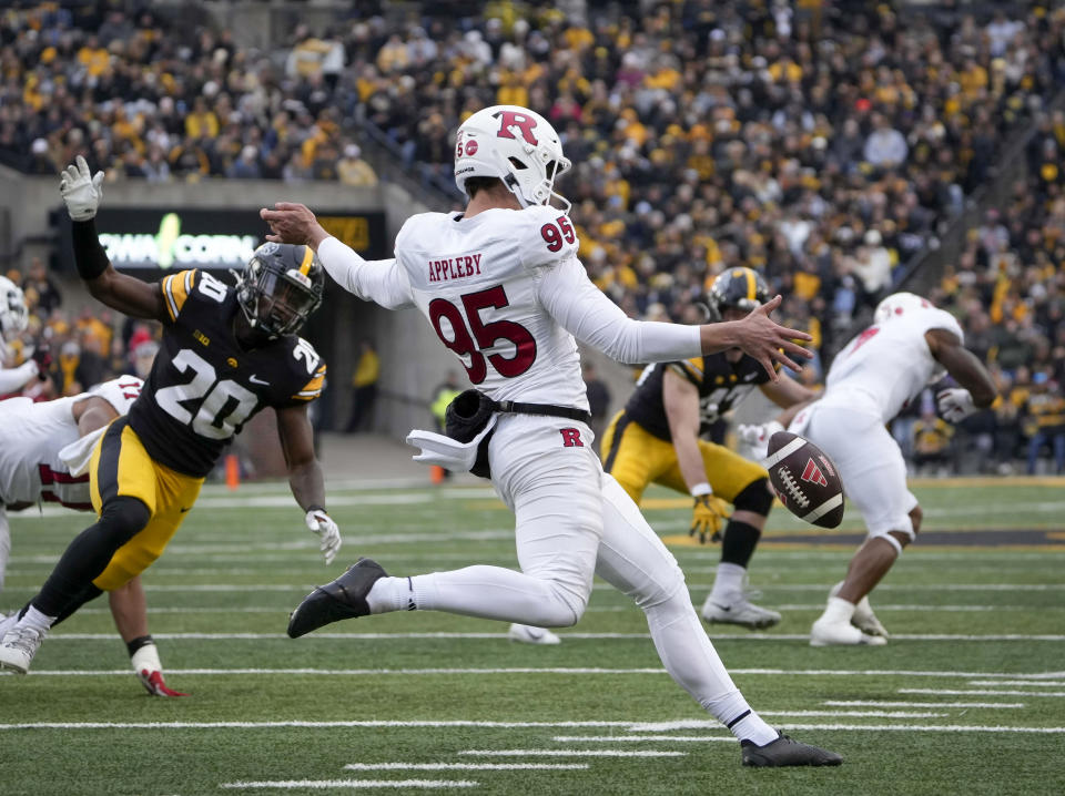 Rutgers punter Flynn Appleby (95) boots the ball against Iowa during the first half of an NCAA college football game, Saturday, Nov. 11, 2023, in Iowa City, Iowa. (AP Photo/Bryon Houlgrave)