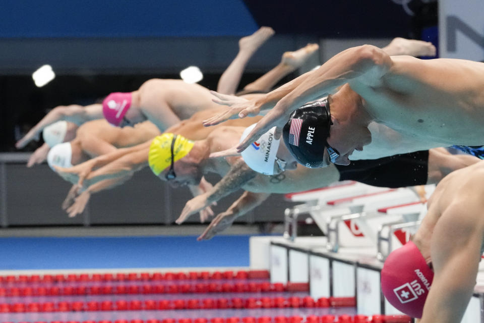 Zach Apple, of the United States, starts in a men's 100-meter freestyle semifinal at the 2020 Summer Olympics, Wednesday, July 28, 2021, in Tokyo, Japan. (AP Photo/Petr David Josek)