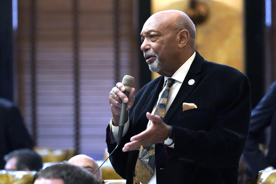 State Rep. Bo Brown, D-Jackson, questions Rep. Joey Hood, R-Ackerman, unseen, during his presentation of legislation in the House Chamber, Thursday, March 3, 2022, in Jackson, Miss., that would limit how race can be taught in schools and universities. Black lawmakers raised concerns that if the bill becomes law, it would stifle honest lessons about racism. Hood explained the bill said repeatedly that it would not prevent the teaching of history, but would only prevent teaching that any person is superior or inferior because of race, sex or national origin. (AP Photo/Rogelio V. Solis)